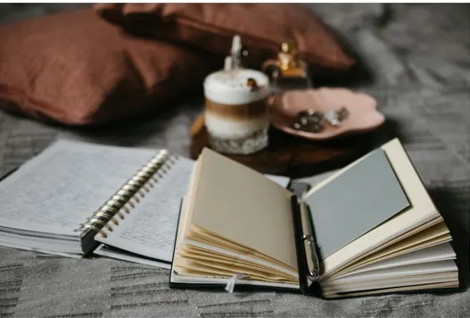 Open notebook and coffee on a desk
